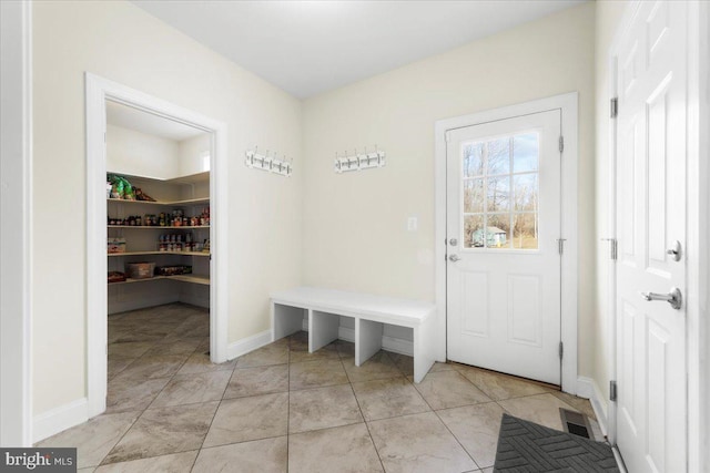 mudroom featuring light tile patterned floors