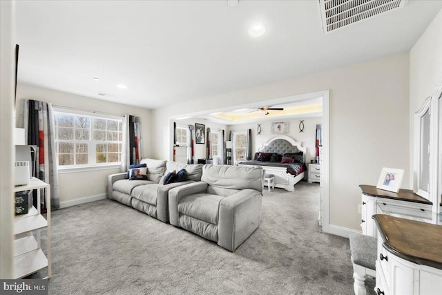 living room featuring light carpet and ceiling fan