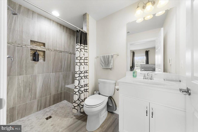 bathroom with vanity, toilet, a chandelier, and a shower with shower curtain