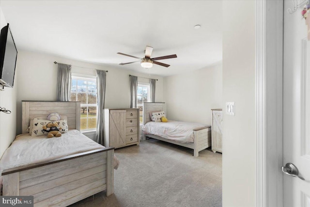 carpeted bedroom with ceiling fan