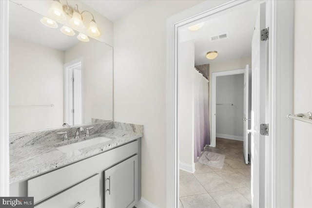 bathroom with vanity and tile patterned flooring