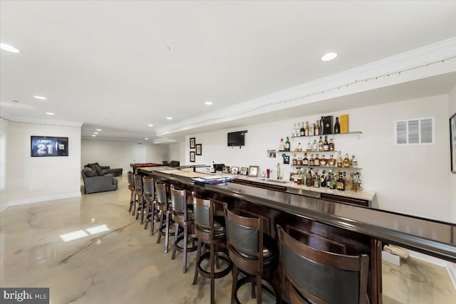 bar with crown molding and sink