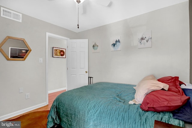 bedroom featuring wood-type flooring and ceiling fan