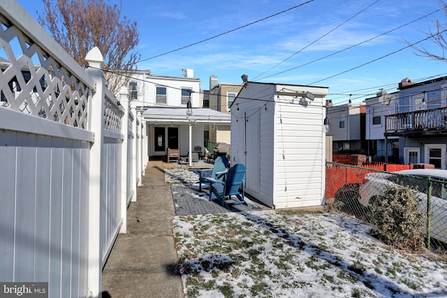 exterior space featuring a patio and a storage unit