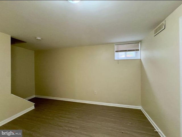 basement with dark wood-type flooring