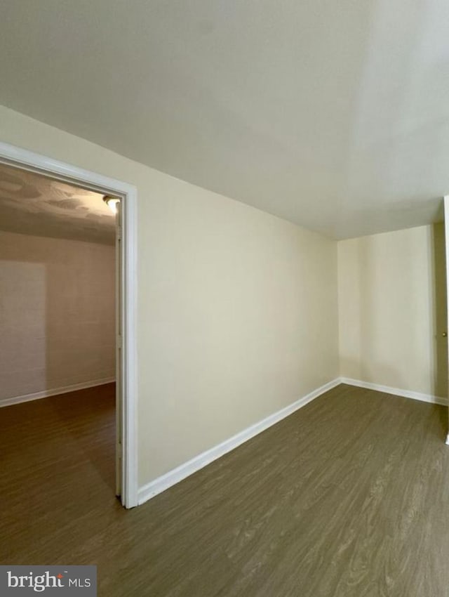 bonus room featuring dark wood-type flooring