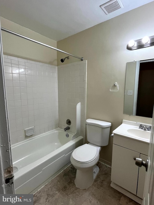 full bathroom with visible vents, baseboards, toilet, shower / tub combination, and vanity