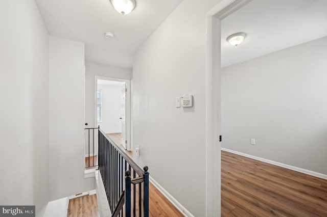 corridor featuring hardwood / wood-style floors