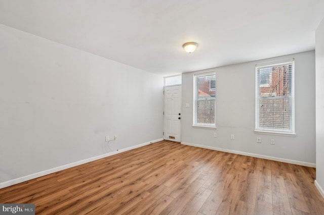 empty room with light wood-type flooring