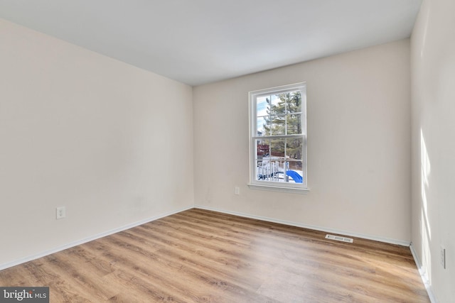 unfurnished room featuring light hardwood / wood-style flooring