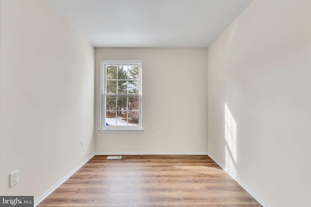 unfurnished room featuring light hardwood / wood-style flooring