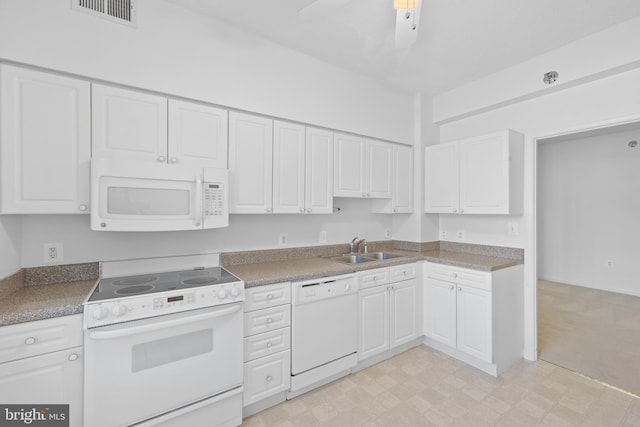 kitchen featuring sink, white appliances, white cabinets, and ceiling fan