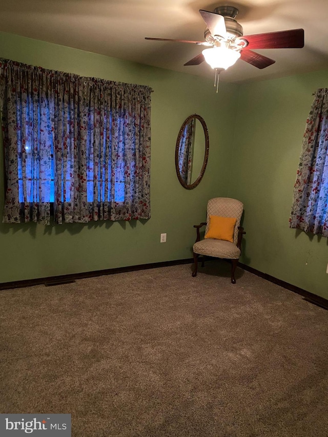 unfurnished room featuring carpet floors and ceiling fan