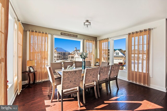 dining room with dark wood-type flooring