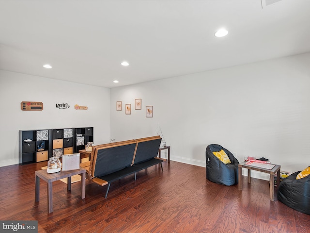 living room with dark hardwood / wood-style floors