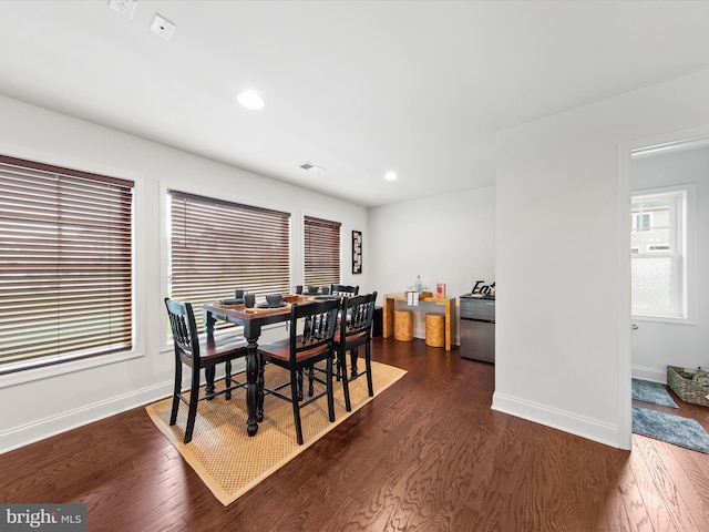 dining room with dark hardwood / wood-style floors