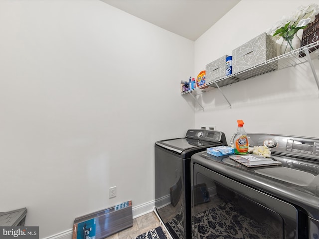 laundry area featuring hardwood / wood-style flooring and independent washer and dryer