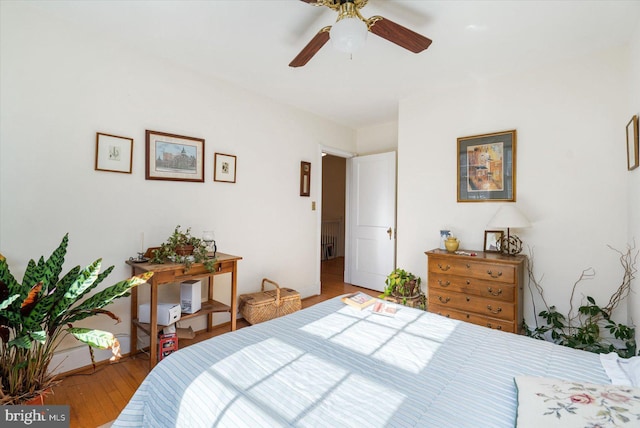 bedroom featuring ceiling fan and light hardwood / wood-style flooring