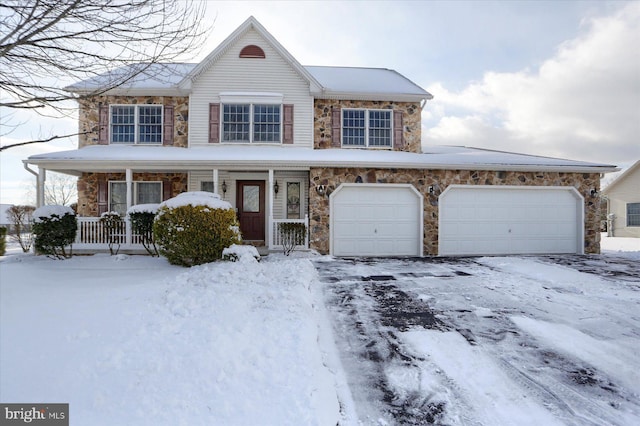 view of front of house with a porch and a garage