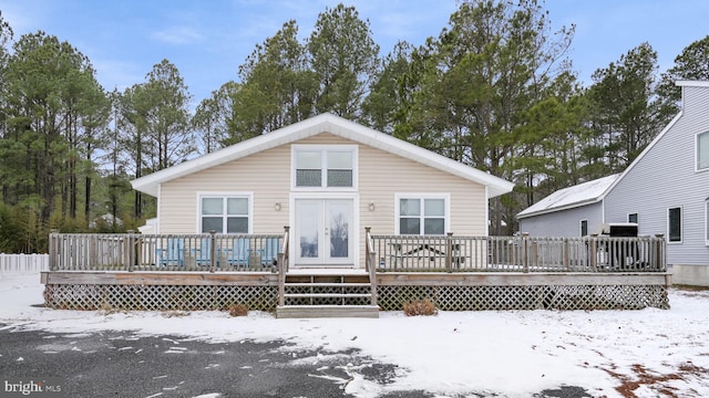 snow covered property featuring a deck