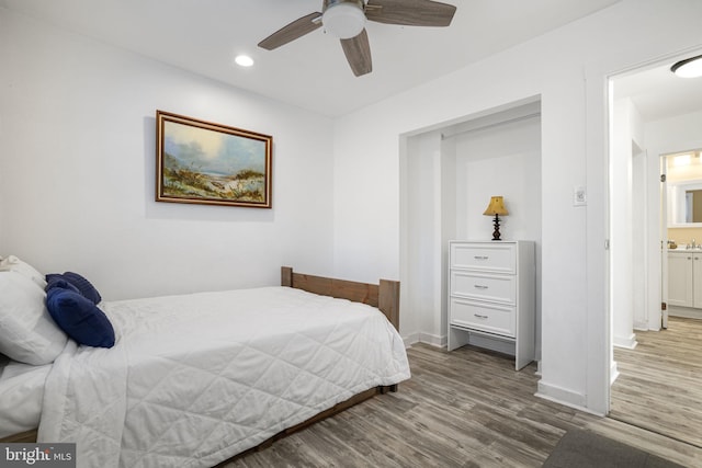 bedroom with wood-type flooring and ceiling fan