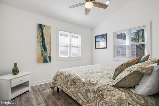 bedroom with lofted ceiling, dark wood-type flooring, and ceiling fan