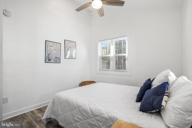 bedroom with ceiling fan and dark hardwood / wood-style flooring