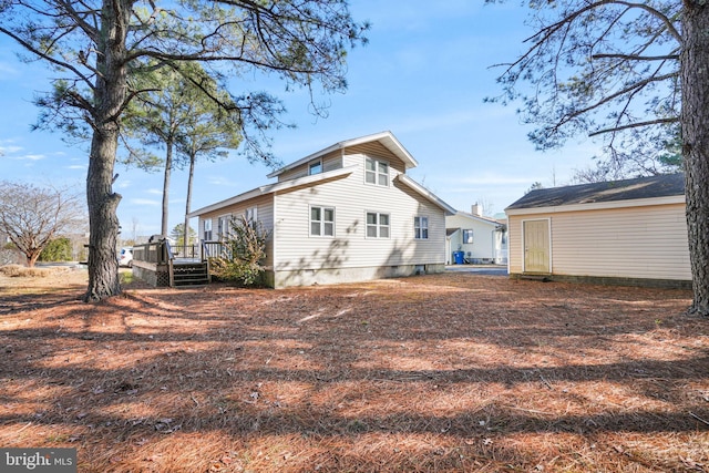 rear view of property with a deck