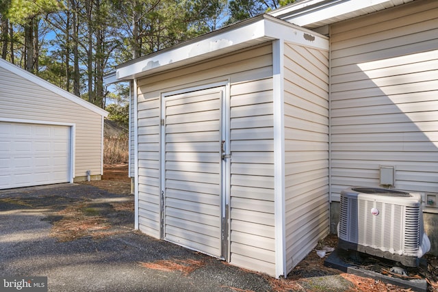 view of outbuilding featuring central air condition unit