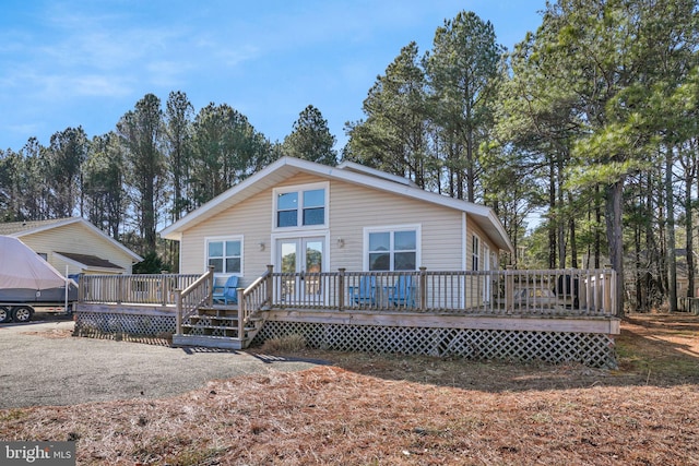 view of front of property featuring a wooden deck and french doors