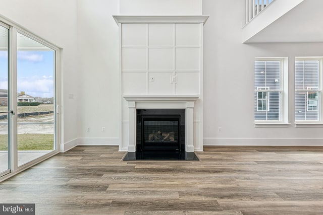 unfurnished living room featuring light wood-type flooring