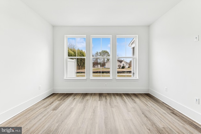 spare room with light hardwood / wood-style floors