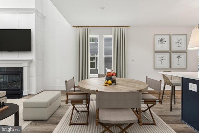 dining area with wood-type flooring