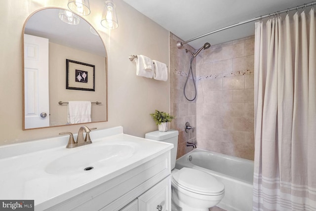 full bathroom featuring vanity, toilet, and shower / bath combination with curtain