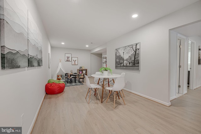 dining space featuring light hardwood / wood-style floors