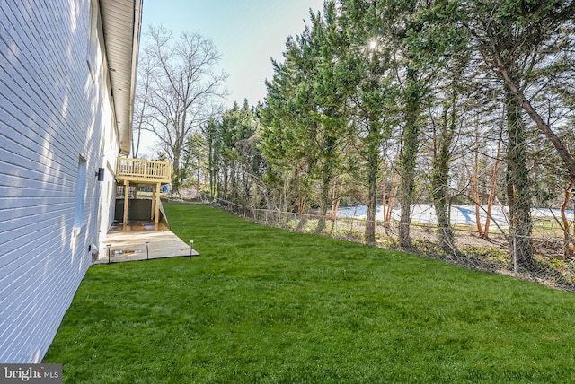 view of yard with a wooden deck