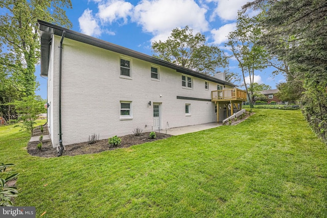 3300 Red Pine St, Falls Church, VA 22041 - rear view of house with a lawn, a patio area, a wooden deck, and brick siding
