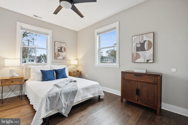 bedroom featuring dark hardwood / wood-style flooring and ceiling fan