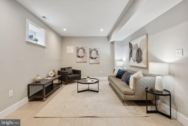 living room with light hardwood / wood-style floors