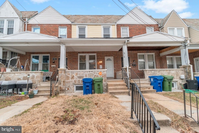 multi unit property featuring a porch