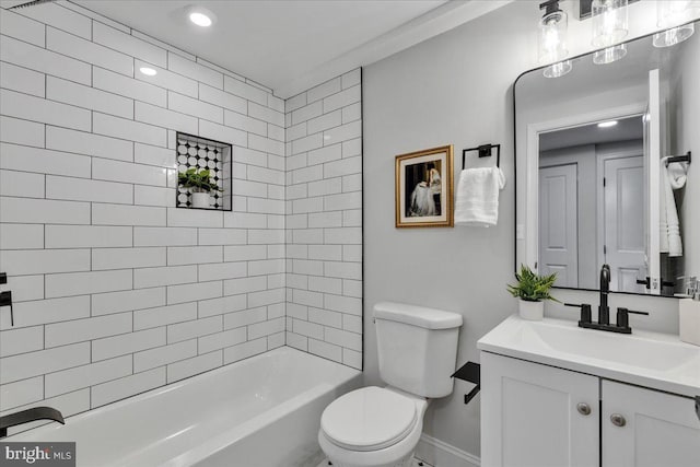 full bathroom with vanity, toilet, and tiled shower / bath combo