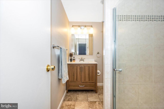 bathroom featuring an enclosed shower and vanity