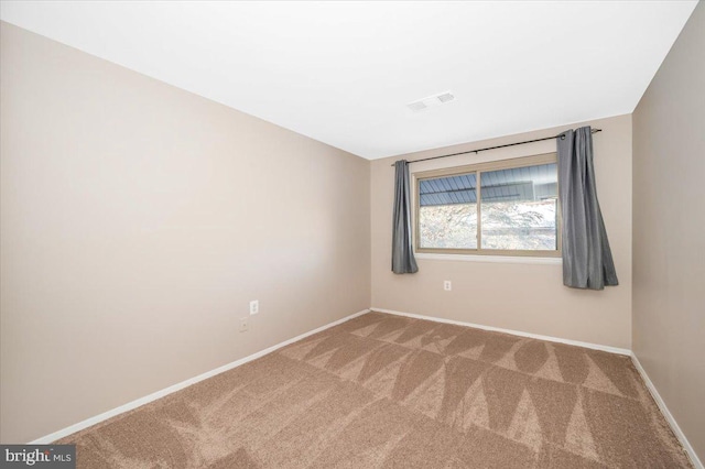 view of carpeted spare room