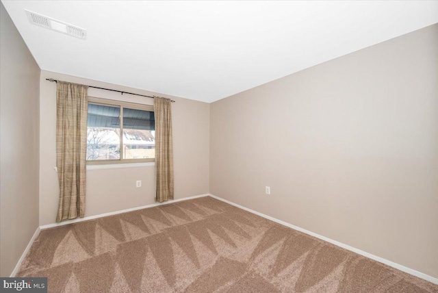 unfurnished room featuring carpet flooring