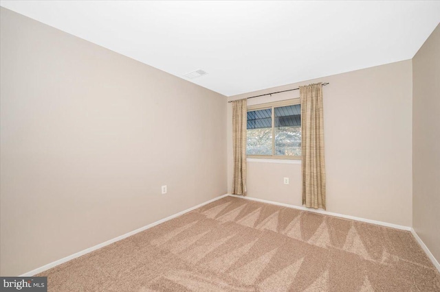 empty room with carpet flooring