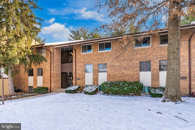 view of snow covered property