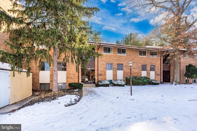 view of snow covered property