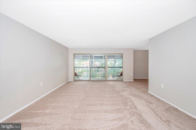 empty room with light colored carpet