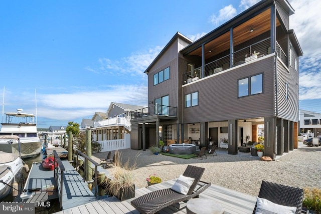 back of house featuring a balcony