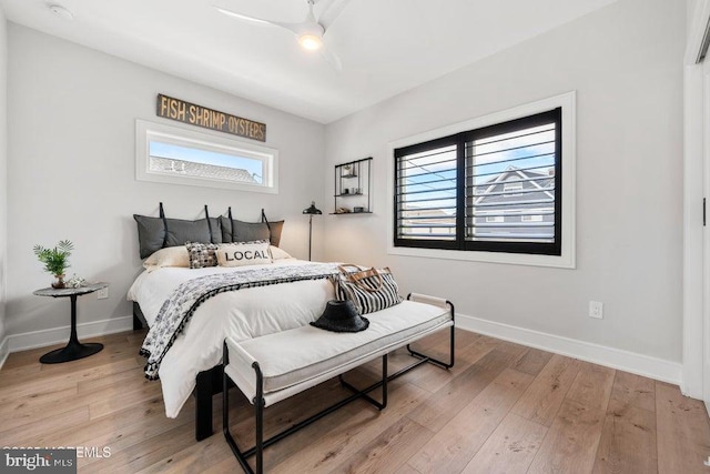 bedroom featuring ceiling fan and hardwood / wood-style flooring